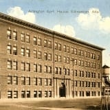 Exterior view of Arlington Apartments, captured in a historical photograph.