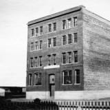 Exterior view of the Mercer Warehouse, taken around 1912.