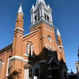 Front view of St. Joachim's Roman Catholic Church showcasing the tower in detail.