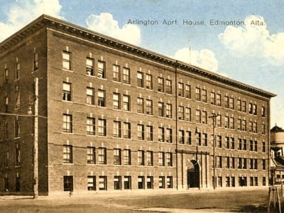 Exterior view of Arlington Apartments, captured in a historical photograph.